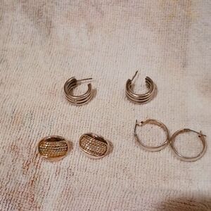 Three  pairs of ladies silver tone earrings, two hoops and a button style one